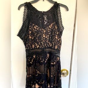 Black colored jumpsuit for any occasion. Size M. Never worn with tags on.